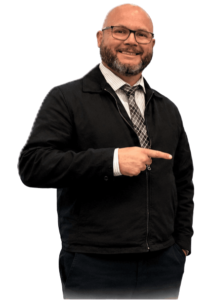 Carlos Campos pointing toward the benefits of his automotive service